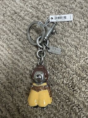 Coach Disney X Princess Belle Bear Keychain in Yellow and Brown with Silver
